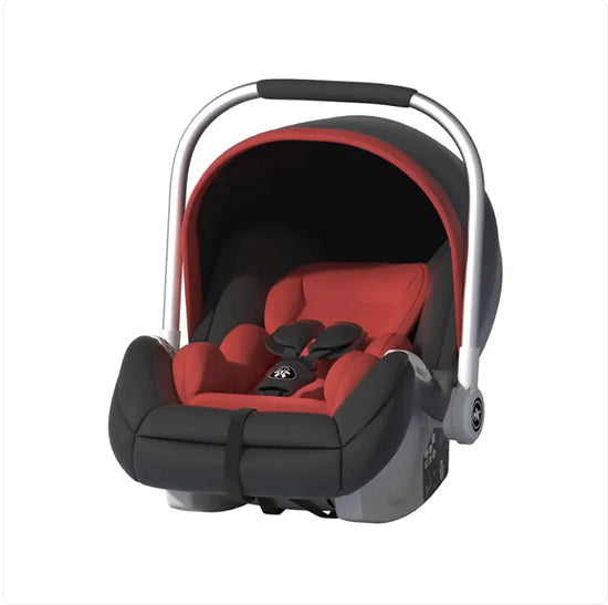 Red and black infant car seat with handle on white background