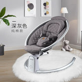 Gray quilted baby rocker chair in modern nursery with plush rug and decor