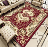 Elegant living room with ornate red and cream floral area rug, classic sofas, tufted bench