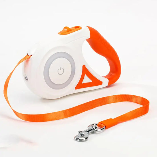 Orange and white retractable dog leash with ergonomic handle and power button design