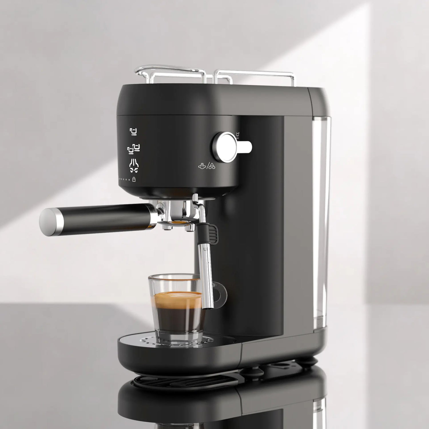 Modern black espresso machine making coffee in a clear glass on a reflective countertop