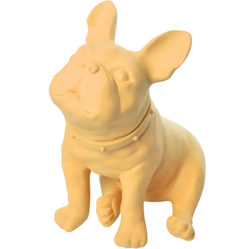 Yellow French bulldog figurine with studded collar on white background
