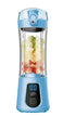 Blue portable blender with digital display, filled with assorted fruit cubes.