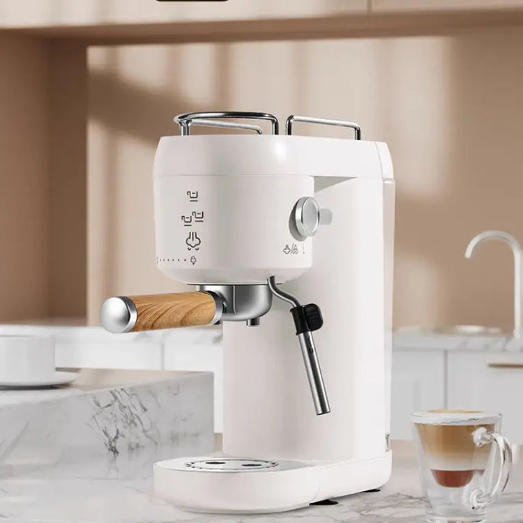 Modern white espresso machine with wood handle on marble kitchen counter, latte nearby