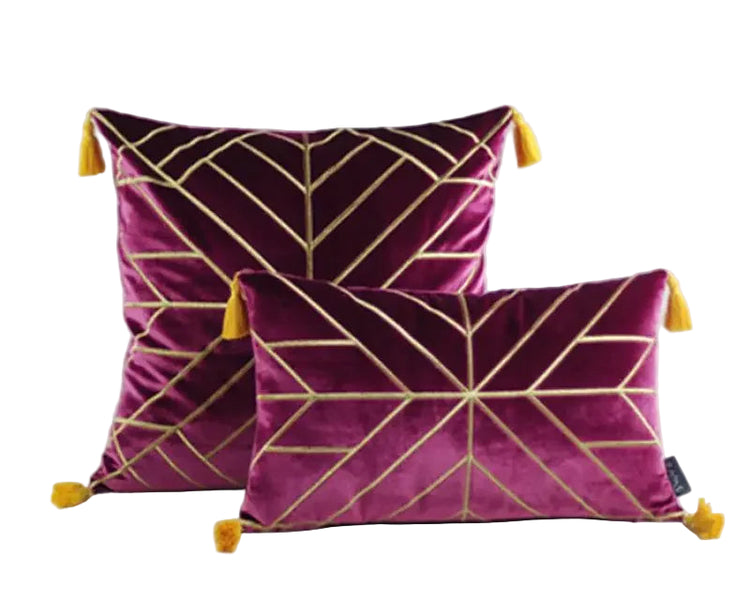 Set of two purple velvet throw pillows with gold geometric lines and yellow tassels