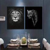 Modern dining room with lion and lioness wall art, elegant table setting, glass centerpiece