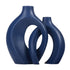 Modern navy blue ceramic vases with abstract, curved openwork design