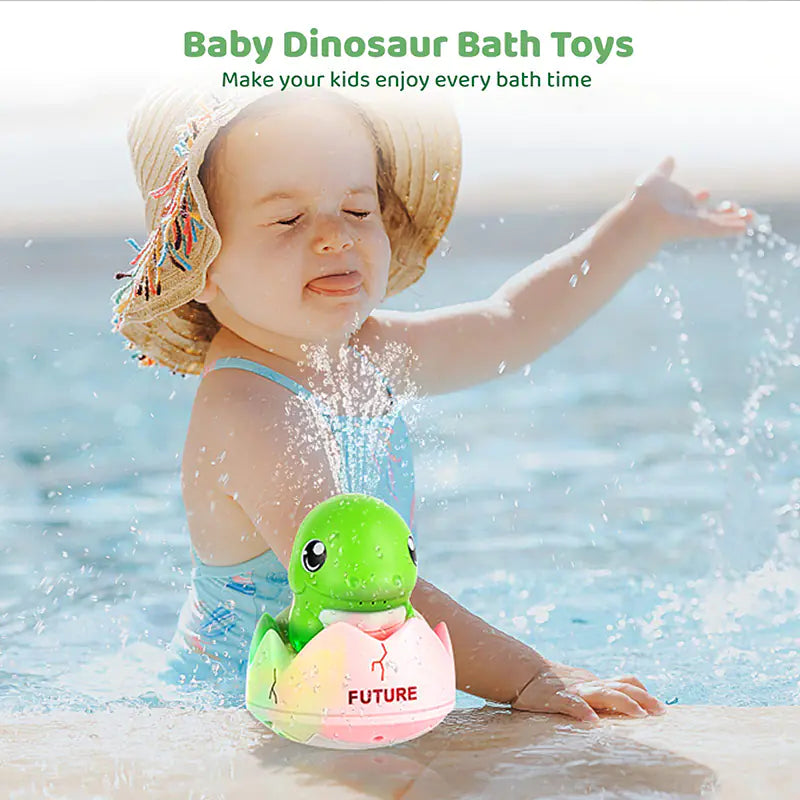 Baby playing in pool with green dinosaur bath toy spraying water