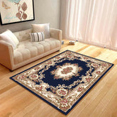 Elegant living room with cream sofa and ornate navy floral area rug on wooden floor
