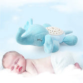 Sleeping baby with blue elephant plush night light toy on soft cloud background