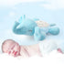 Sleeping baby with blue elephant plush night light toy on soft cloud background