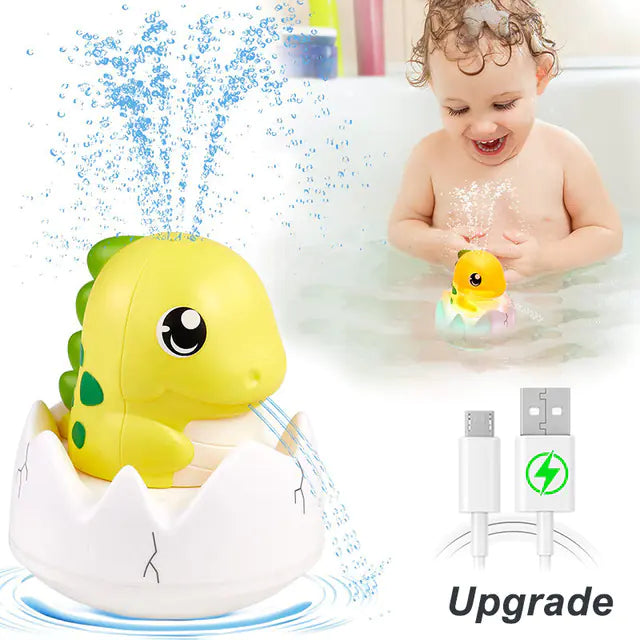 Baby playing with dinosaur egg bath toy that sprays water, USB charging cable shown