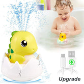 Baby playing with dinosaur egg bath toy that sprays water, USB charging cable shown