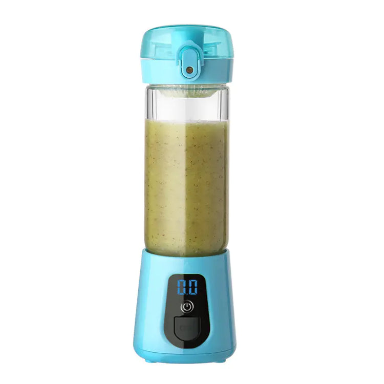 Portable blue electric blender with digital display, filled with green smoothie
