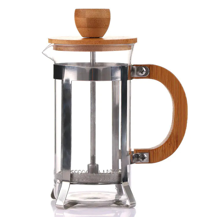 Glass French press coffee maker with bamboo lid and handle on white background
