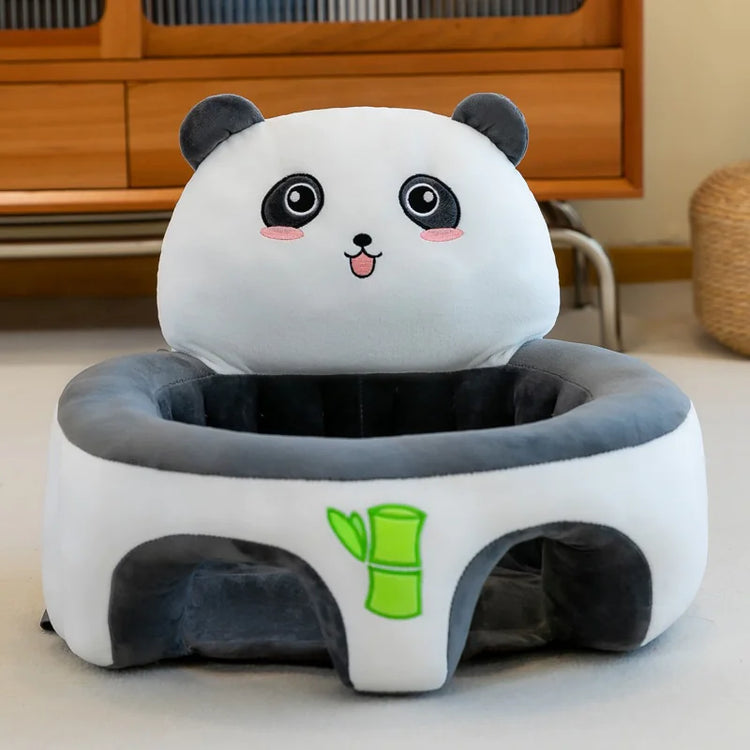Plush panda-shaped baby seat with bamboo design on soft indoor carpet
