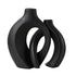 Modern black ceramic vases with abstract geometric design on white background