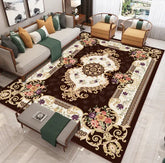 Elegant living room with vintage floral area rug, modern sofa, and accent chairs