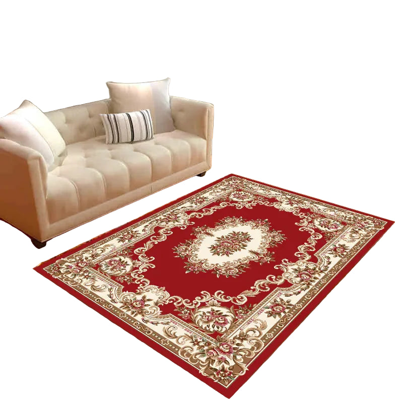 Elegant red and beige floral area rug in cozy living room with beige sofa and wall art