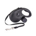 Black retractable dog leash with ergonomic handle and metal clip