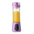 Purple portable blender with digital display and orange juice inside