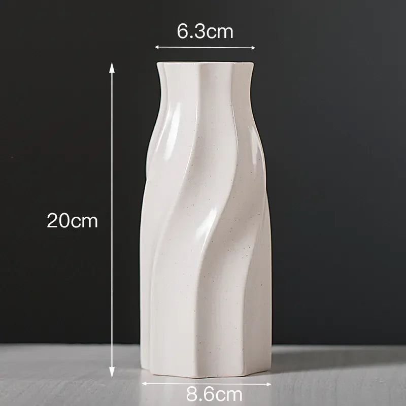 White ceramic vase with swirl design, 20cm tall, 8.6cm base, 6.3cm top diameter