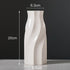 White ceramic vase with swirl design, 20cm tall, 8.6cm base, 6.3cm top diameter