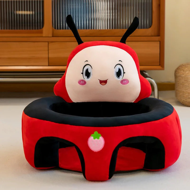 Cute red ladybug plush baby seat with smiling face in a modern living room