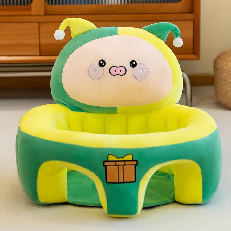 Plush green and yellow pig baby seat with gift box design in cozy living room